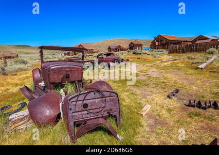 Rusty car wrecks of some old cars of 1930s, in Bodie state historic park, Californian Ghost Town of 1800s. United States of America close to Yosemite Stock Photo