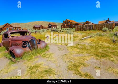 Rusty wreck of the vintage old car of the 1930s, in Bodie state historic park, Californian Ghost Town. The United States of America. Stock Photo