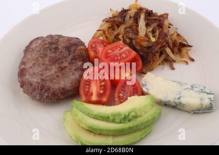 burger with gorgonzola, onion tomato cherry and avocado Stock Photo