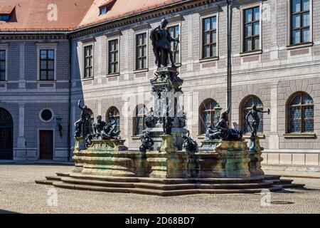 The bronze Wittelsbach Fountain in the Residenz Palace was erected in 1610. Munich, Germany. Octagonal yard called Fountain Courtyard, Brunnenhof, is Stock Photo