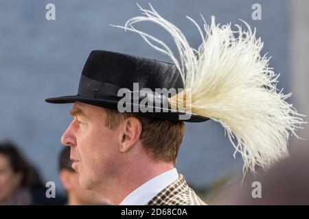 Thanksgiving, public celebration in the village Spitz in the Wachau. Traditional costume of men with hat and Steinfeder (bush of feather gras). The Wa Stock Photo