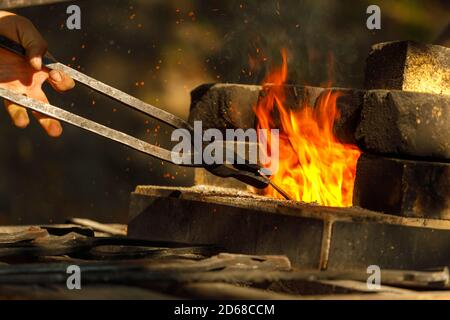 a burning forge made of bricks in nature Stock Photo