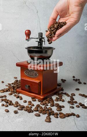 Vintage manual spice grinder on wooden background Stock Photo - Alamy