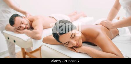 beautiful couple during back massage, joint day at the spa. Man and woman enjoy a massage Stock Photo