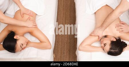 Thai back massage, two women friends during a relaxing massage, top view. Anti-stress massage at Thai spa resort Stock Photo