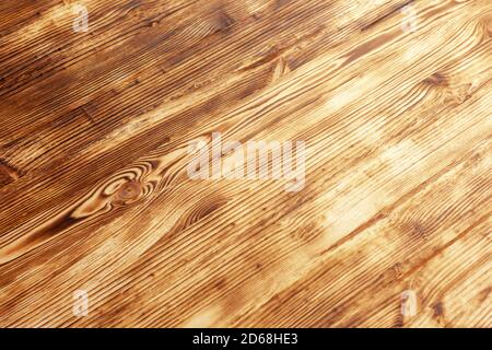 burnt brushed wooden surface is located diagonally Stock Photo
