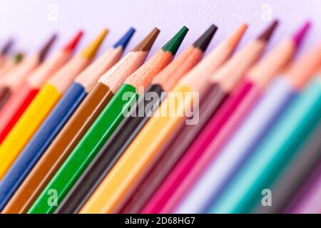color pencils on purple background, close-up Stock Photo