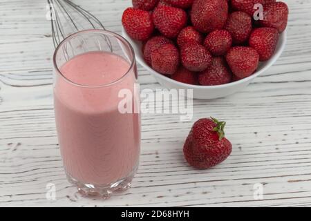 strawberry cocktail, blender and plate with strawberries Stock Photo