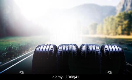 Tire on autumn road. Banner concept. Stock Photo
