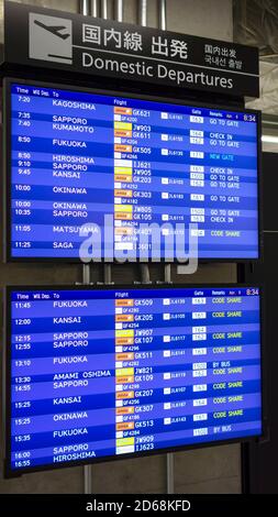 Tokyo, Japan - April 8, 2015. Departure Board at Narita Airport, Tokyo. Narita airport is an international airport serving the greater Tokyo area. Stock Photo