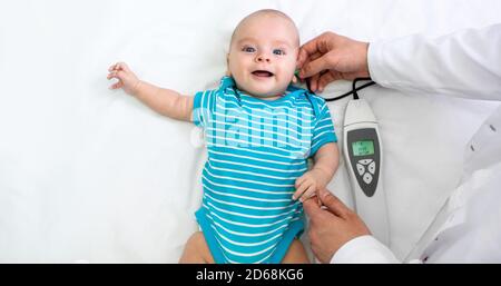 Newborn hearing screening and diagnosis at the hospital. Baby having hearing screening, Otoacoustic Emissions Stock Photo