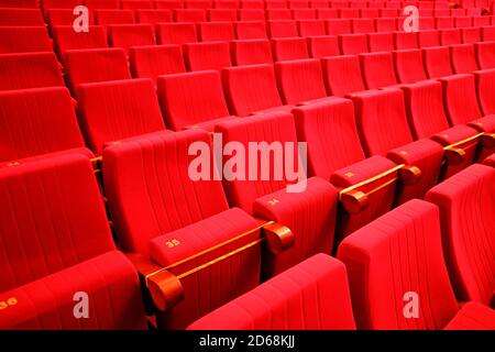 seats in the theater. Social distance between spectators in the hall Stock Photo