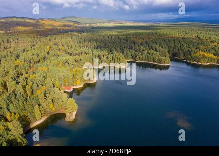 Aerial view of Loch Vaa and red boathouse  in Cairngorms National Park near Aviemore, Scottish Highlands, Scotland, UK Stock Photo