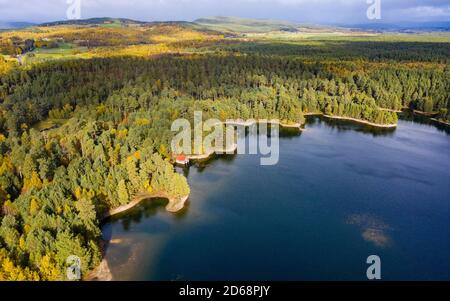 Aerial view of Loch Vaa and red boathouse  in Cairngorms National Park near Aviemore, Scottish Highlands, Scotland, UK Stock Photo