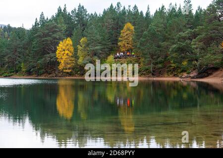 Autumn view An Lochan Uaine more commonly known as the Green Loch due to the striking green colour of itÕs water in Cairngorms National Park Scotland