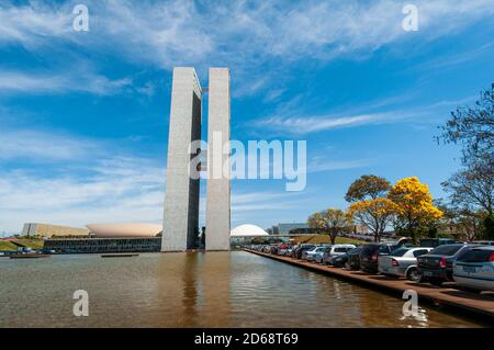 National Congress with yellow ipe trees in bloom, Brasilia, DF, Brazil on August 14, 2008. Stock Photo