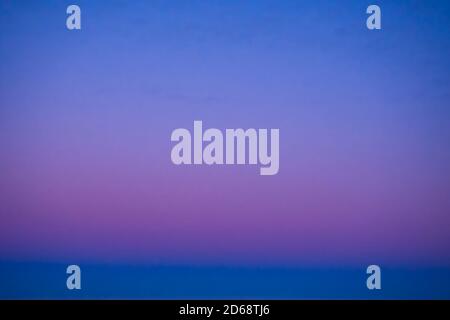 Gradient of the evening cloudless sky, blue and pink colors Stock Photo
