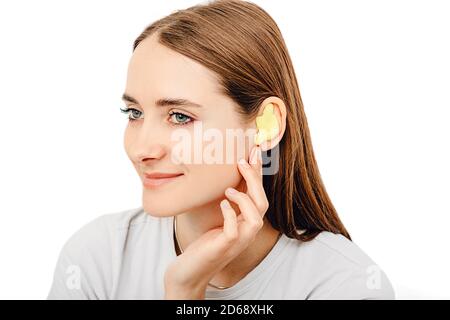 Process of making earplug from an impression of an individual s woman ear. Ear close-up. Personally molded earplugs. Part of the set Stock Photo