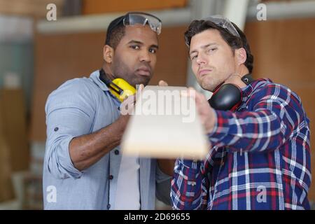 two wood workers in carpentry Stock Photo