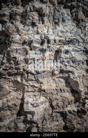 Background of limestone masonry. The surface is decorated with natural material. The wall is made of wild stone. High quality photo Stock Photo