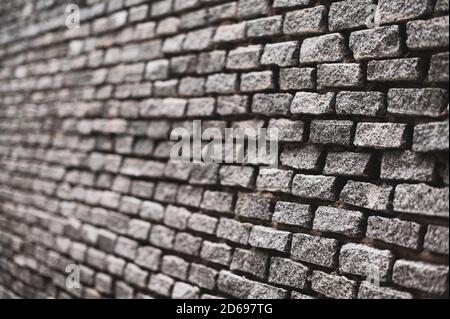 Shallow depth of field with Old vintage brick wall. Abstract architectural loft background for design. Stock Photo