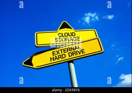 Cloud storage vs External Hard Drive - Traffic sign with two options - service and hardware for protection and storage of data. Security and backup of Stock Photo