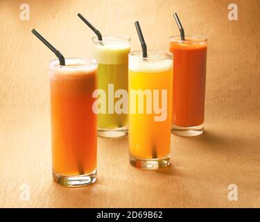 Various freshly squeezed fruits juices Stock Photo