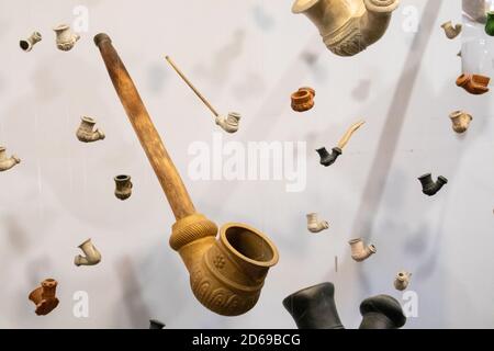 Vintage ceramic tobacco smoking pipes installation on white background in Zaporozhian Sich. Ukrainian Cossack culture heritage on Khortytsia island, U Stock Photo