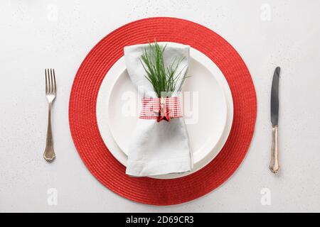 Christmas table setting with white and red decorations. View from above. Stock Photo
