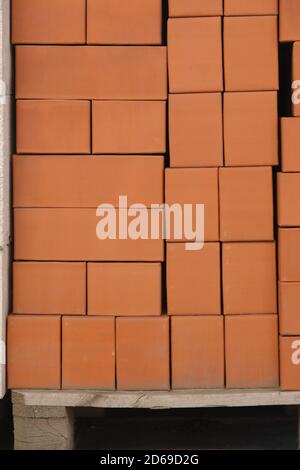 Clay brown bricks on construction market. Stock Photo