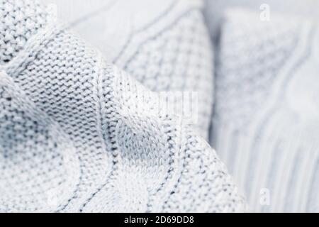 Light blue gray fabric background. Full frame shot of knitted fabric Stock Photo