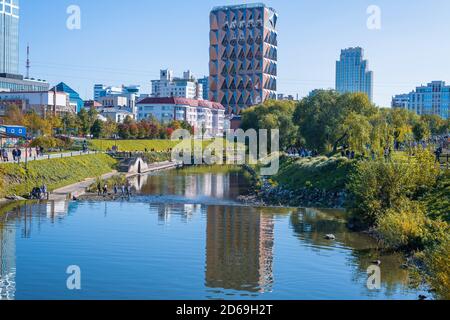 urban landscape in autumn. river, houses, dam. Ekaterinburg Stock Photo