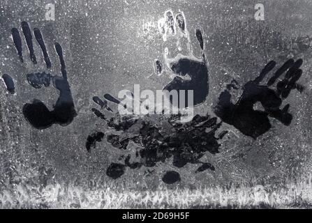 Handprints on frozen car window in the winter in Norway. Stock Photo