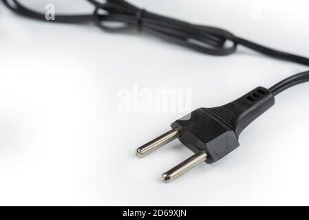 220 volt plug detail with cord on a white Stock Photo