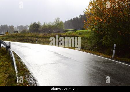 wet road in autumn Stock Photo