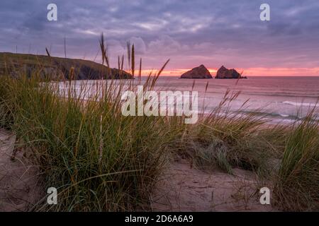 Holywell bay Sunset with sand dunes at Holywell Bay near Newquay in Cornwall Stock Photo