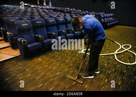 Guwahati, India. 15th Oct 2020. A worker cleaning a cinema hall as cinema hall to reopen during unlock 5.0 in Guwahati on 15 October 2020. Credit: David Talukdar/Ģ����ý Live News Stock Photo