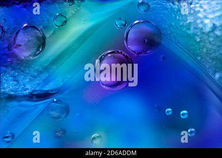 macro Photo of Colored Bubbles in Corner of Glass of Drink Stock Photo