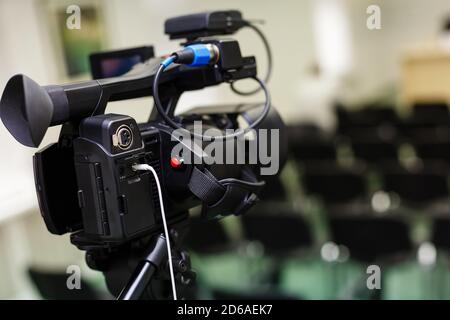Two professional video camera on tripod. Panasonic camera. Isolated on white background Stock Photo