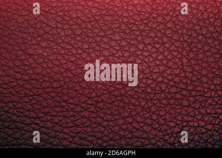 color leather texture background. dark red texture of genuine leather. Backdrop background texture effect for design. Artificial eco leather closeup. Stock Photo