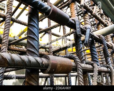 Metal threaded couplings connecting reinforcing rebars. Reinforcement framework Stock Photo