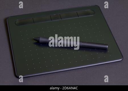 Graphic tablet on a black background. Stock Photo