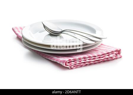 Dessert plates and spoons on checkered napkin isolated on white background. Stock Photo