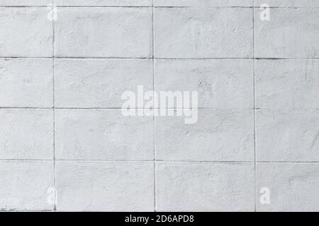 White brick walls that are plastered background and texture. The texture of the block is white. Background of empty block basement wall. Stock Photo