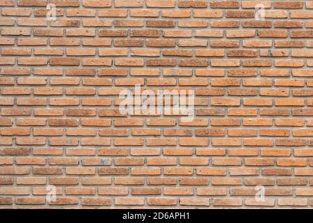 brick walls background and texture. The texture of the brick is orange. Background of empty brick basement wall. Stock Photo