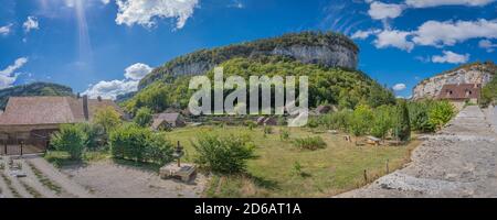 Baume-Les-Messieurs, France - 09 01 2020: View of the village of Baume-les-Messieurs and cliffs behind Stock Photo