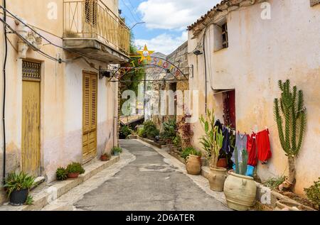Parrini, Sicily, Italy - September 27, 2020: Narrow street in the center of ancient village Parrini in the municipality of Partinico, province of Pale Stock Photo