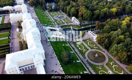 Aerial of Peterhof Castle, with the gardens and water fountains with the water canals behind it Stock Photo