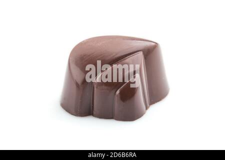 Single chocolate candy isolated on white background. side view, close up. Stock Photo