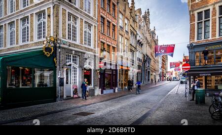 Early Morning activity on the normally busy Steenstraat in the historic city of Brugge in Belgium Stock Photo